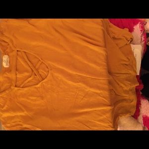 I’m selling a mustard collared shirt.